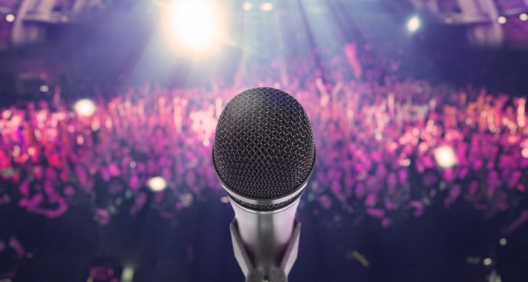 Microphone with an audience on the background